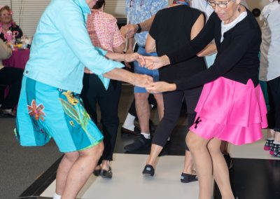 Meadows residents dancing at the Rock Around the Clock Sock Hop