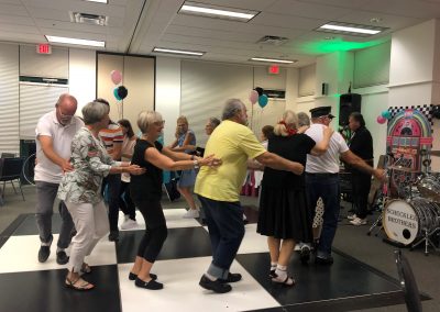 Meadows Community Association Sock Hop residents doing the locomotion